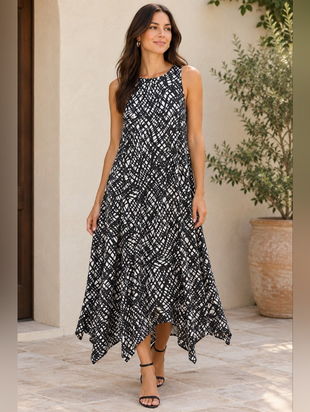 🪭 DKNY Sleeveless Black & White Pattern Handkerchief Hem Dress